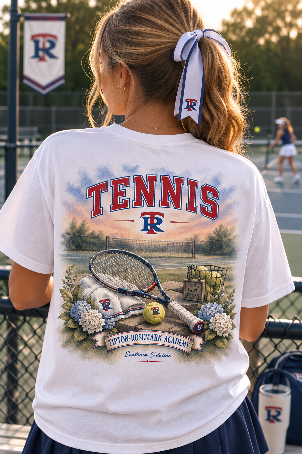 Tipton-Rosemark Academy tennis watercolor design on a white tee